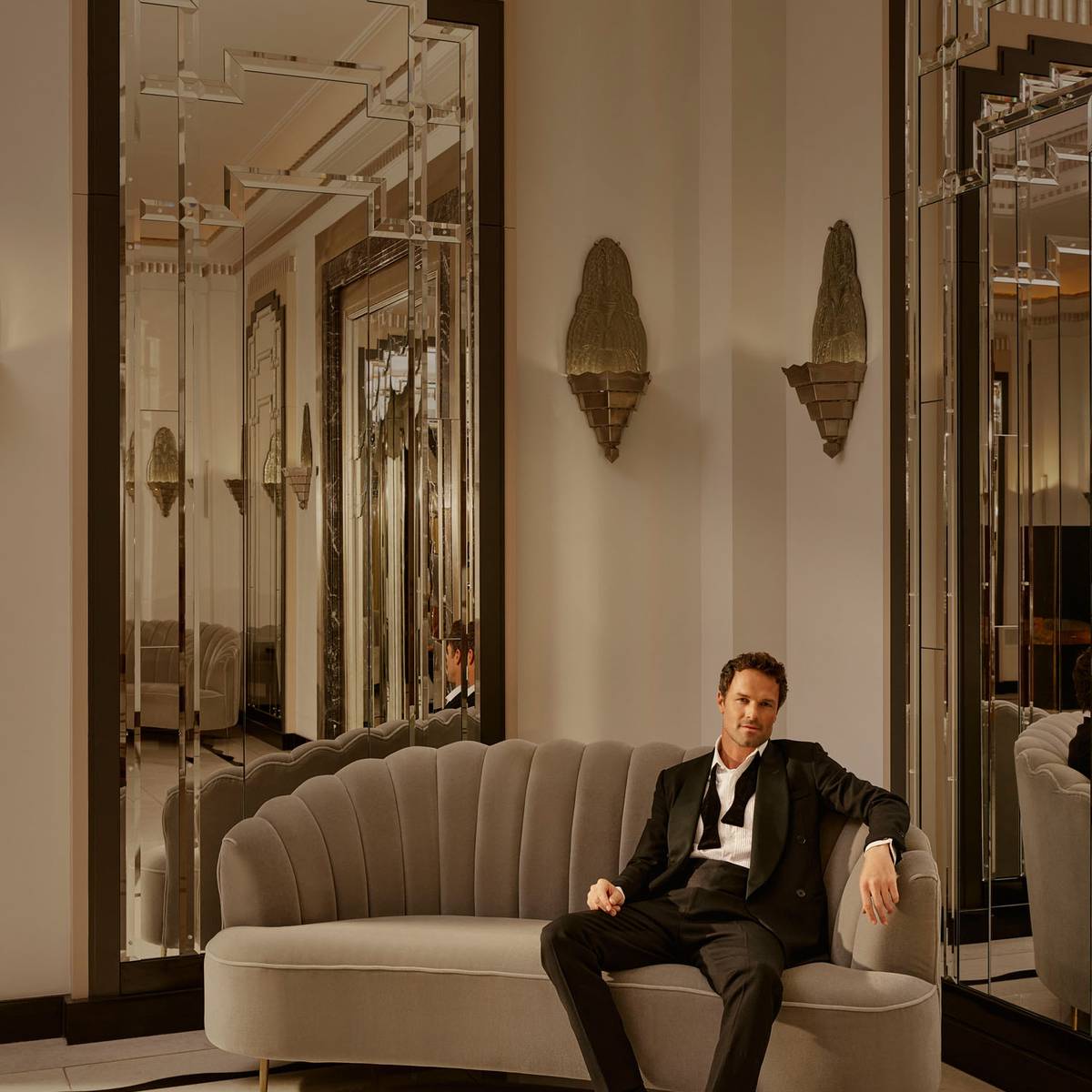 Claridge's Ballroom man sitting on couch