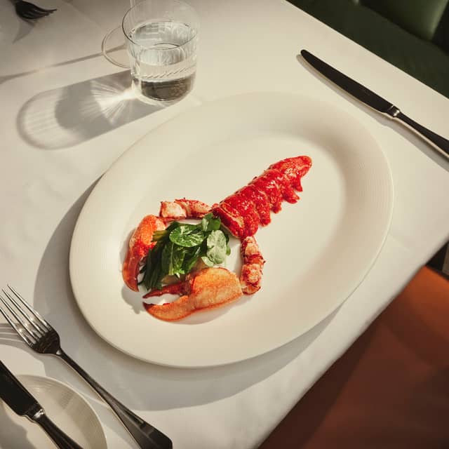 Maybourne red lobster on a plate with a knife and fork