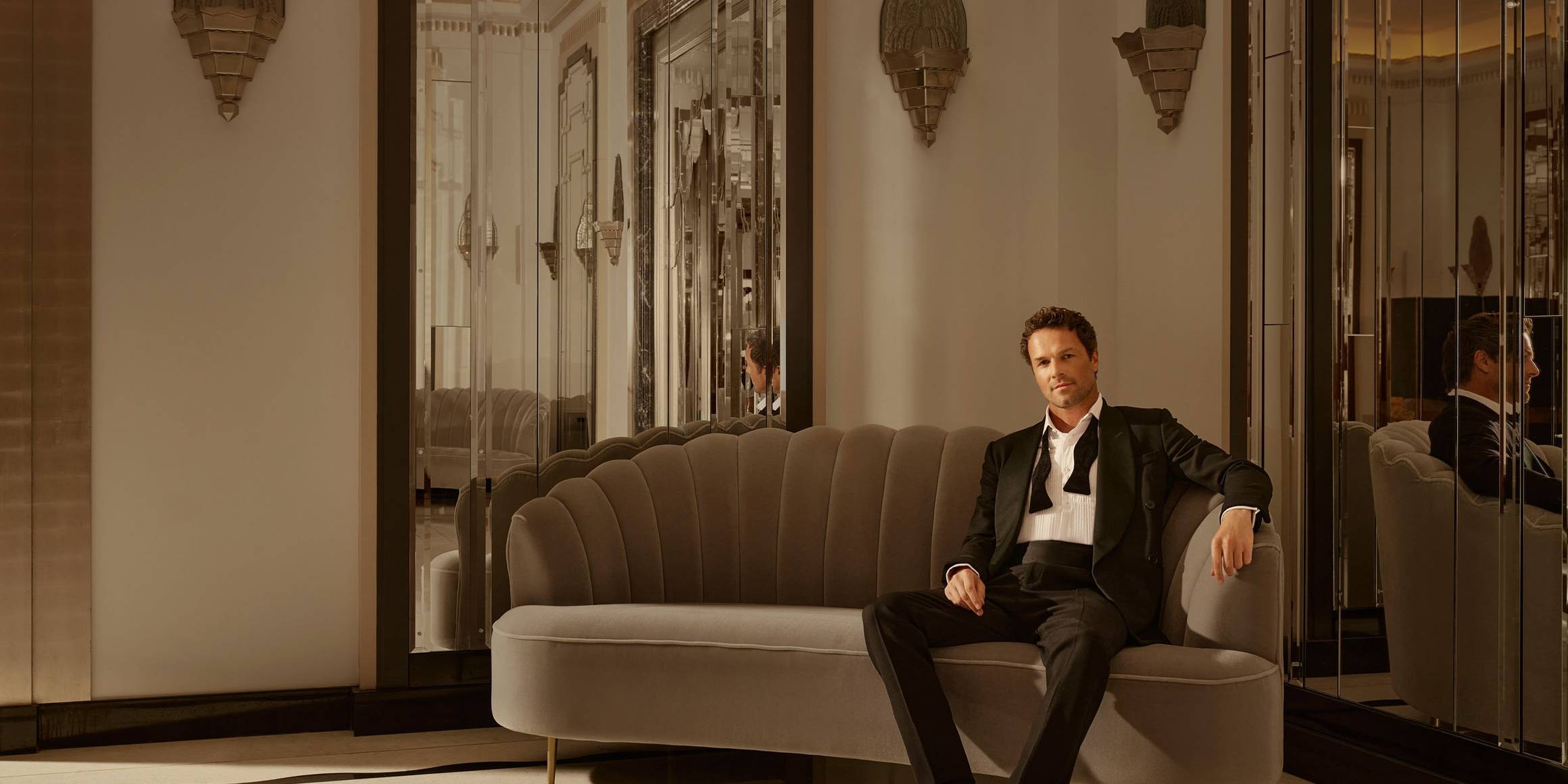 Claridge's Ballroom man sitting on couch