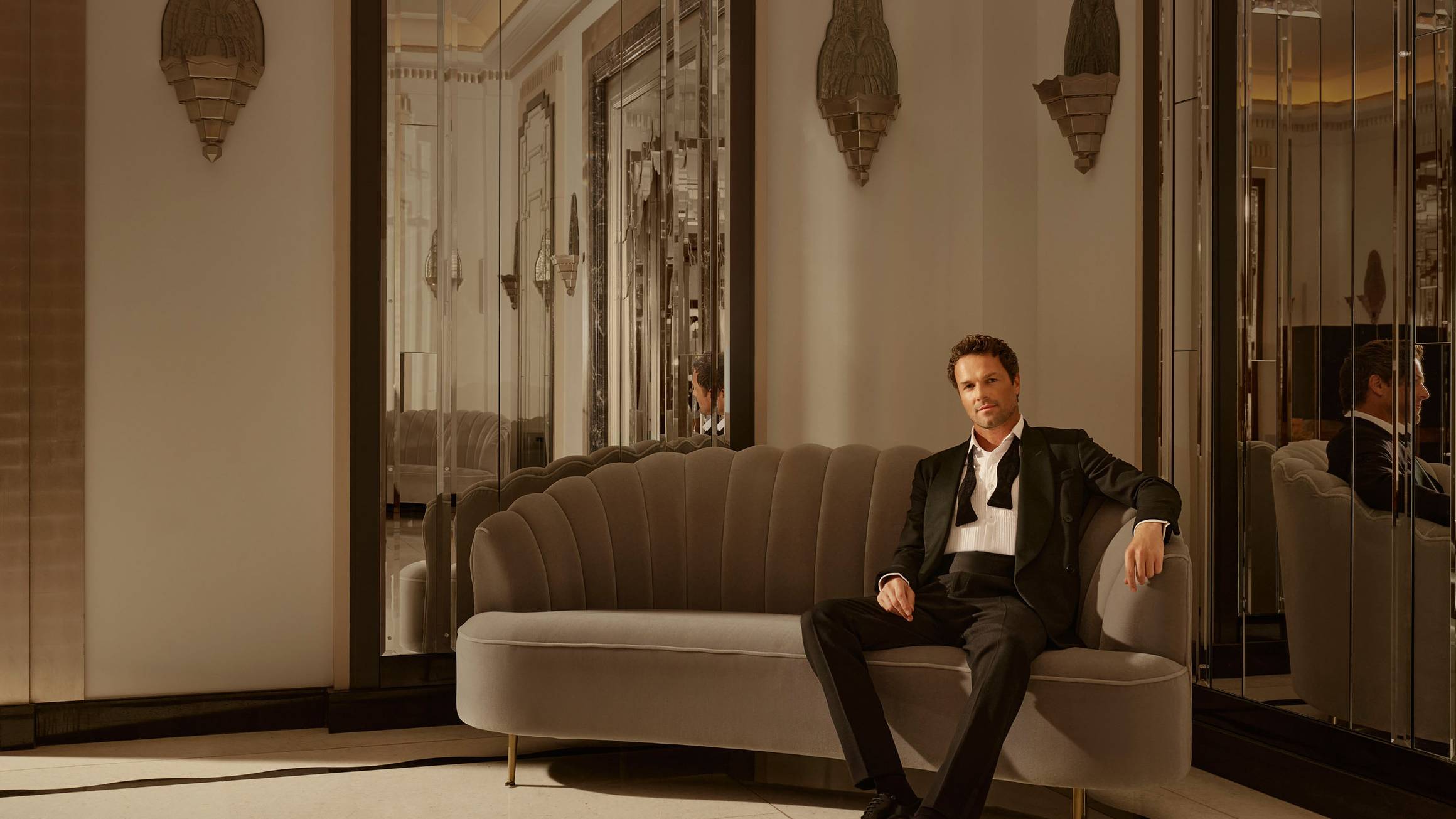 Claridge's Ballroom man sitting on couch