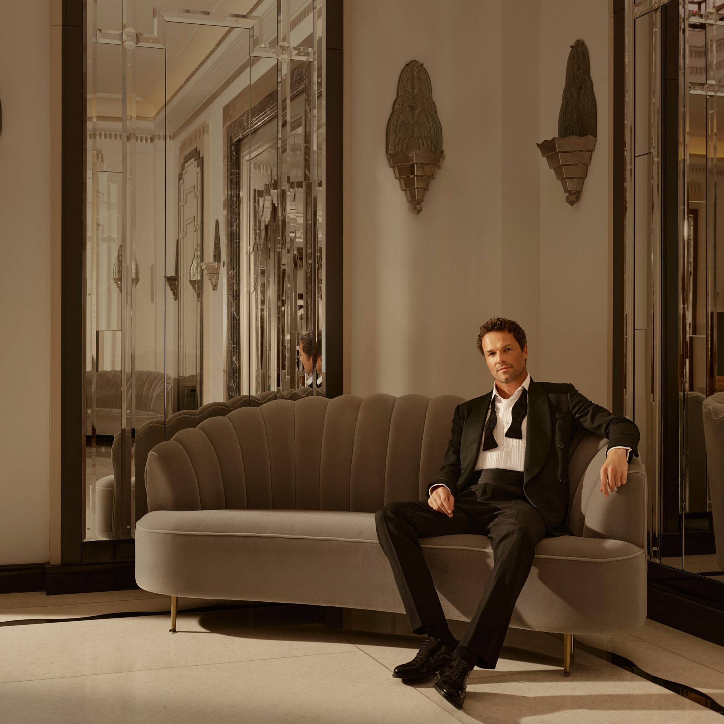 Claridge's Ballroom man sitting on couch