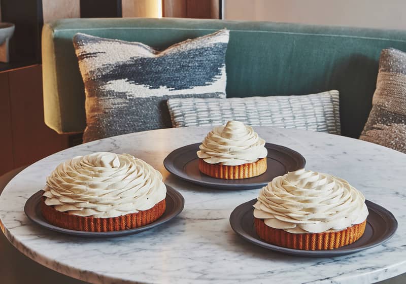 Cedric Grolet cakes sitting on a marbe table