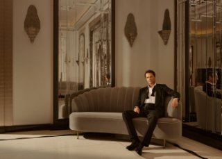 Claridge's Ballroom man sitting on couch